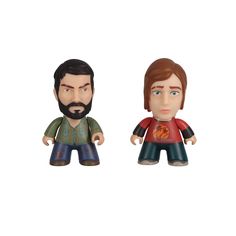 two small figurines, one with a beard and the other with an orange shirt