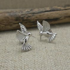 "This item ships in 3 to 5 days. Pretty Hummingbird Stud Earrings .925 Sterling Silver Butterfly Post Backing 1/2\" wide x 5/8\" long Stamped .925 Nicely gift boxed with silver cloth. Hummingbird Earrings by Keith Jack Jewelry  Imported from Canada Signed by the Artist (Keith Jack) Ships Free within the USA 21 Day Returns Items must be returned in new unworn condition." Tiny Figurines, Hummingbird Earrings, Earrings Butterfly, Metalsmithing Jewelry, Funky Jewelry, Silver Butterfly, Favorite Rings, Hummingbirds, Sterling Silver Studs