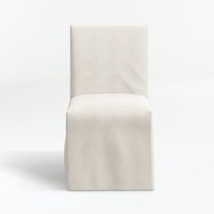 a white chair sitting on top of a white floor