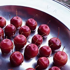 there are many cherries that have been placed in the pan on the stove top