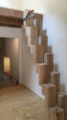 a staircase made out of wood blocks in a room