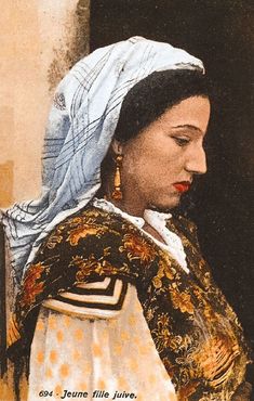 an old photo of a woman in traditional dress