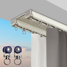 two security cameras mounted to the side of a curtain