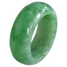 Certified Green Burmese solid A-Jadeite Infinity Band Cocktail Ring for men and women (unisex). Untreated, and 100% Natural, Our finest and most translucent series of Burmese A-Jadeite Infinity Band Rings. Our handpicked exclusive Jadeite is crafted into unique rings, each with the ideal optics and strength. Each ring is unique and exclusively One-of-One. With fibrous interwoven hues, this jadeite has a rich-light green tone with splashes of lighter jadeite and streaks and spots of dark jadeite. Infinity Band Ring, Infinity Band, Green Tone, Jade Ring, Green Tones, Burmese, Cocktail Ring, Cocktail Rings, Unique Rings