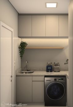 a kitchen with a washer and dryer in it