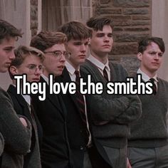 there are many young men standing together with the words they love the smiths