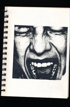 a black and white photo of a man's mouth with teeth on the page