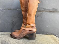 Freebird Clive Women 6 Brown Leather Distressed Tall Boots Side Zip Snap Buckle Awesome shoes with minor scuffs check photos. PLEASE VIEW ALL PHOTOS CAREFULLY AS I CONSIDER THEM PART OF THE DESCRIPTION. I WILL GLADLY COMBINE SHIPPING FOR MULTIPLE ITEMS PURCHASED IF THEY CAN BE SAFELY SHIPPED TOGETHER. DELIVERY WITHIN 5 BUSINESS DAYS, 1-2 BUSINESS DAY HANDLING. ONCE YOUR PAYMENT CLEARS, THIS ITEM WILL COME PROFESSIONALLY PACKAGED AND SHIPPED WITH CARE. PLEASE CONTACT ME THROUGH MESSAGES IF YOU HAVE ANY QUESTIONS OR CONCERNS. THANKS FOR LOOKING Awesome Shoes, Tall Boots, Boot Shoes Women, Nice Shoes, Kenya, Side Zip, Leather Straps, Brown Leather, Womens Boots