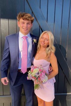 a young man and woman dressed in formal wear