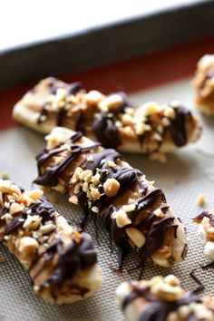 there are chocolate and nuts on the cookie sheet