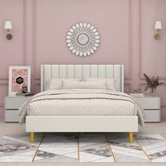 a bedroom with pink walls and white furniture