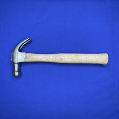 an old hammer on a blue background