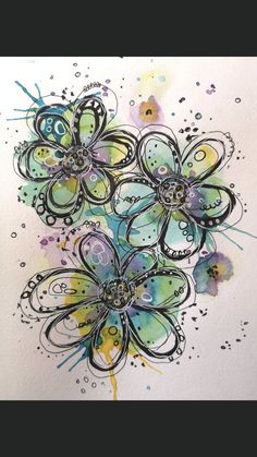 some watercolors and ink on paper with flowers in the middle, one is blue and