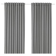 a pair of grey curtains hanging on the side of a window