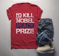 Men's Funny Ironic T-Shirt I'd Kill For Nobel Peace Prize Shirt Grunge Hipster TeeIrony makes the world go round don't you think? I love finding humor in ironic situations. This funny t-shirt reads 'I'd Kill For A Nobel Peace Prize' in a stencil grunge distressed font that helps set the mood for what the words say. Obviously you'd never do it, but a Nobel Peace price would be such an amazing honor to receive. The joke, do I have to explain it? I think not. Share a laugh in this hilarious t-shirt Receive Love, Distressed Font, Grunge Tee, Give Love, Nobel Peace Prize, Distressed Tee