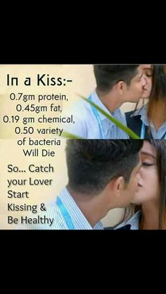 a couple kissing each other in front of a poster with the words in a kiss