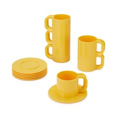 yellow plastic cups and saucers with plates on the side, set of four in front of white background