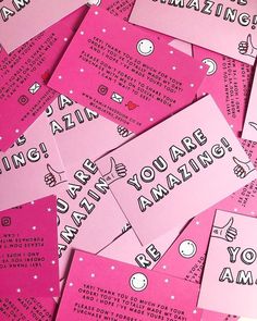 pink and black post it notes with the words amazing written on them, all piled together