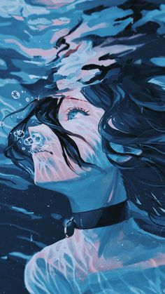 a woman floating in the water with her hair blowing back and looking up at something