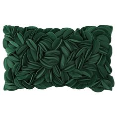 a green pillow with leaves on it