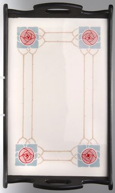 an empty tray with red flowers and blue squares on it's sides, in front of a white background