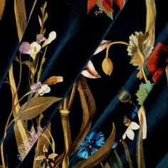 a black background with colorful flowers and leaves on the bottom half of it, along with dark blue fabric