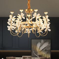 a chandelier hanging from the ceiling in a living room