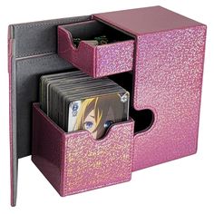 a pink and black box with two cards in it's compartments, one has a wallet