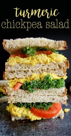 an egg, lettuce and tomato sandwich stacked on top of each other