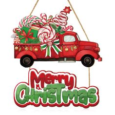 a red christmas truck with candy canes on the back and merry sign hanging from it's side