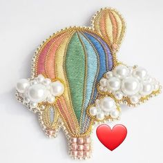 a colorful hot air balloon with pearls on it