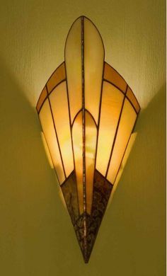 a wall light with a stained glass shade on it