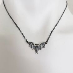 Detailed Bat Necklace.   Sterling Silver Charm 1" x 1/2" on delicate oxidized black sterling silver chain. Chain is 16" + 1.5" extender chain to adjust to your desired length with lobster claw.  Message us if you need a longer chain. Necklace is packaged on an Alexander & Quayle jewelry card inside a 3.5" x 3.5" white jewelry box. Free polishing cloth and sticker included. Makes a perfect gift! Black Sterling Silver Necklace For Halloween, Black Gothic Jewelry With Oxidized Finish, Black Halloween Jewelry With Adjustable Chain, Gothic Halloween Jewelry With Oxidized Finish, Halloween Gothic Jewelry With Oxidized Finish, Gothic Oxidized Jewelry For Halloween, Black Sterling Silver Necklace With Oxidized Finish, Sterling Silver Necklace With Oxidized Black Finish, Adjustable Hypoallergenic Black Necklace