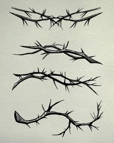 three black and white drawings of barbed wire