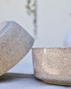 two bowls sitting next to each other on a table