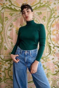 "Forest green turtleneck sweater by Modern Ms. This knit is lightweight and stretchy, semi-sheer when pulled taut. No fiber content labels, based on texture and appearance it is most likely acrylic. Pull over style with no closures or fastenings.  Size XS-S. 32\" chest, 30\" waist, 22.5\" long. 1970's." Spring Turtleneck Sweater, Fitted Green Fine Knit Sweater, Green Long Sleeve Turtleneck For Spring, Green Knit High Neck Top, Green Fine Knit Winter Tops, Fitted Knit High Neck Turtleneck, Green Fitted Casual Sweater, Fitted Knit Turtleneck With High Neck, Green High Neck Sweater With Stretch