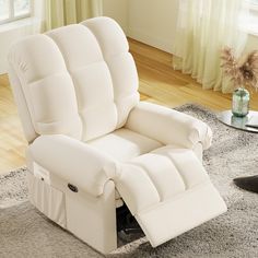 a white reclining chair sitting on top of a rug