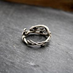 a silver ring sitting on top of a table