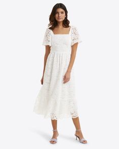 Modern romance. Our Carrie Midi Dress is made from white lace and finished with a stretchy smocked bodice, a flattering square neckline and generous puff sleeves. Obviously, it looks pretty with high-heeled sandals, but you can try it with sneakers, too, for a more casual look.   ======== Lace Colorway: Magnolia White Mother Of The Groom Casual Dresses, Modest White Dress, Feminine Wardrobe, White Lace Midi Dress, Church Clothes, Maxi Outfits, Church Dress, James White, White Dresses For Women