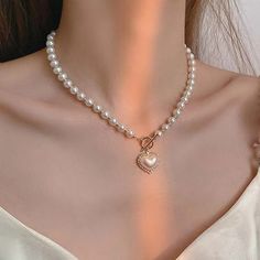 This Is A Simulated Pearl Choker Necklace. Pendant Is Heart Shaped Lined With Some Crystals. Perfect For Wedding Engagements, Formal Party And Any Other Social Gathering. Excellent Piece When In Gown Or Sunday's Best Dresses. Girly Pearl Necklace, Pearl Heart Bead Necklace, Coquette Beaded Necklaces, Pearl Bead Necklace, Heart Pendent, Big Pearl, Wedding Party Jewelry, Pearl Choker Necklace, Pendent Necklace