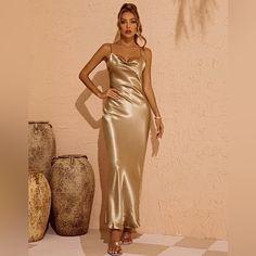 Make A Bold Statement With This Stunning Sandra Satin Backless Maxi Dress In Gold In Your Wardrobe. You'll Be Ready For What The Day Throws At You With This Dress Featuring A Scoop Neckline, Tie Straps, And A Delicately Open Back Detailing. Suitable For Going Out With Friends And Become The Most Beautiful Scenery. Material: 100% Polyester Stretch Factor: Slight Stretch Clean: Gentle Machine Wash Never Worn, Excellent Condition With Tags! Gold Sleeveless Slip Dress For Evening, Gold Backless Evening Dress For Spring, Gold Backless Dress For Spring Evening, Gold Midi Length Slip Dress For Evening, Gold Sleeveless Slip Dress For Cocktail, Gold Backless Dress For Evening, Chic Fitted Gold Slip Dress, Elegant Gold Midi Dress With Spaghetti Straps, Gold Fitted Sleeveless Slip Dress