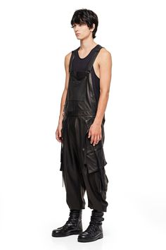 One piece, suit up. Leather Overalls have arrived this season, crafted from the most luxe Cabreta leather with minimal tonal hardware. — Front pocket at chest— Dual asymmetrical button slash pockets at hip— Single cargo pocket on each leg— Single pocket on back.— 100% Cabreta leather; satin lined SIZE + FIT— Loose, tapered, drop fit— Elastic cuffs— Model is 6'1 and wearing a size L CARE— Spot and specialty clean only Overalls For Men, Leather Overalls, Cargo Jumpsuit, Jumpsuit Men, Suit Up, Design Competitions, Cargo Pocket, One Piece Suit, Steampunk Fashion