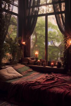 a bed sitting next to a window with candles on it