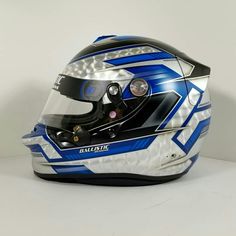 the helmet is designed to look like it has been painted with blue and white stripes