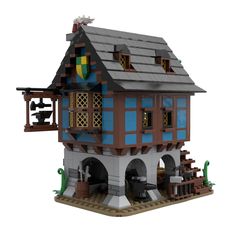 a lego model of a house made out of legos and pieces that look like it has been built