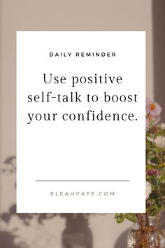 a vase filled with flowers sitting next to a white sign that says use positive self - talk