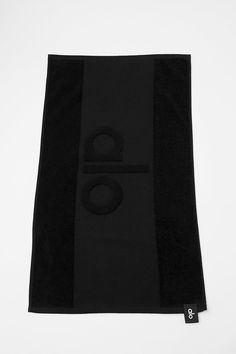 a black towel with the letter o on it