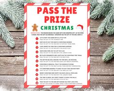 a printable christmas pass the prize game on a wooden table with pine branches and snow