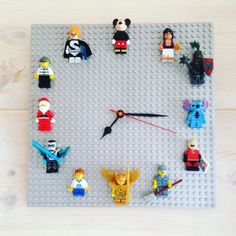 a clock made out of legos on a table