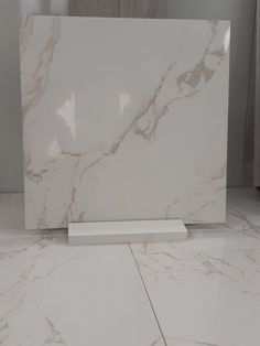 a white marble counter top in a room